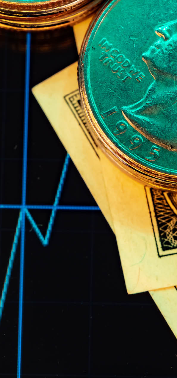 American dollar banknotes and graph on black background close up