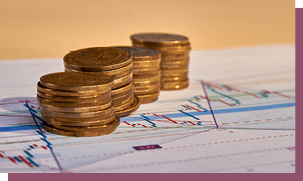 Stacks of money coins with graph paper. Concept of account finance and growth of business.